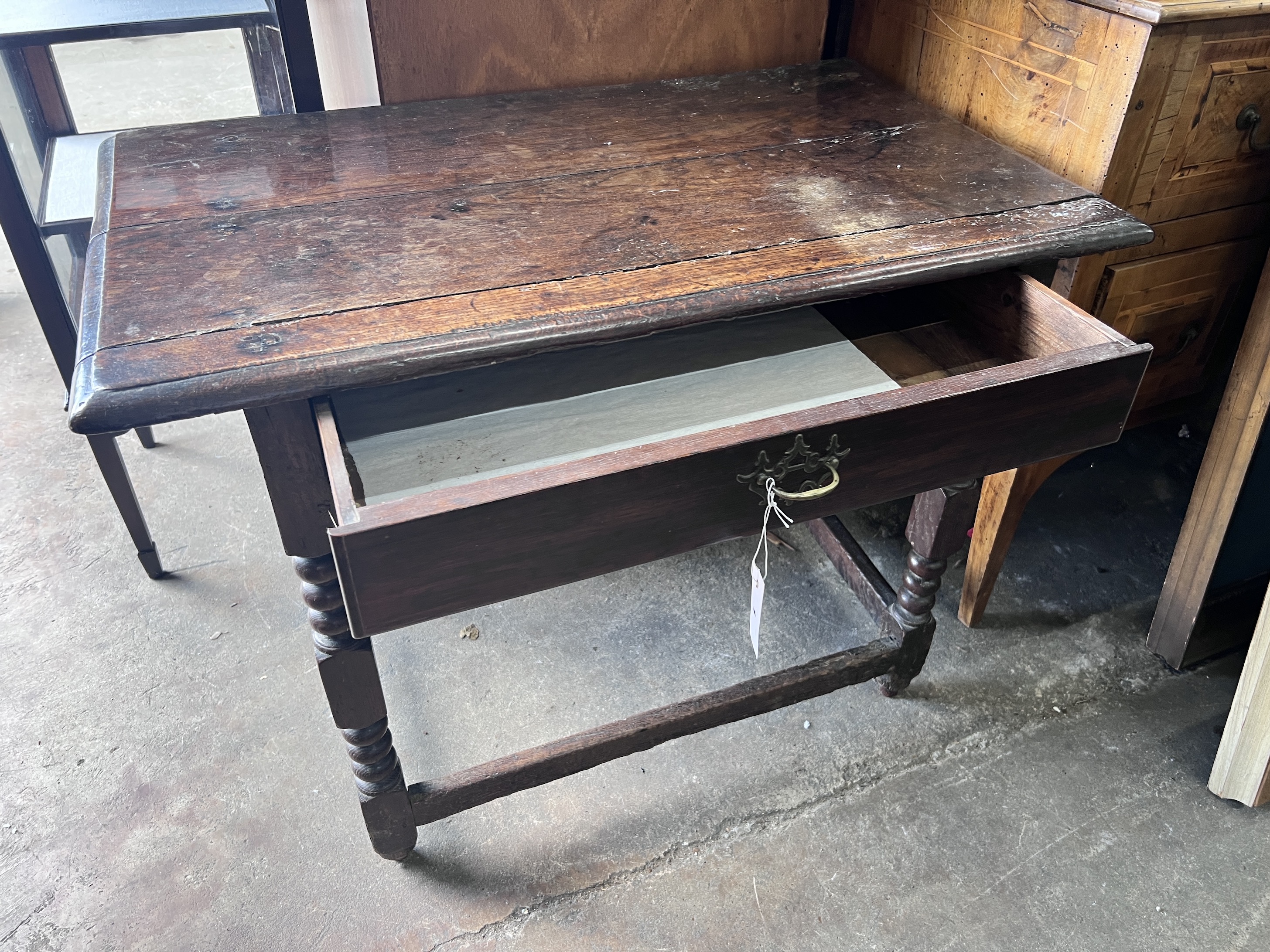 A 17th century oak side table, with bobbin turned legs, width 94cm, depth 54cm, height 69cm